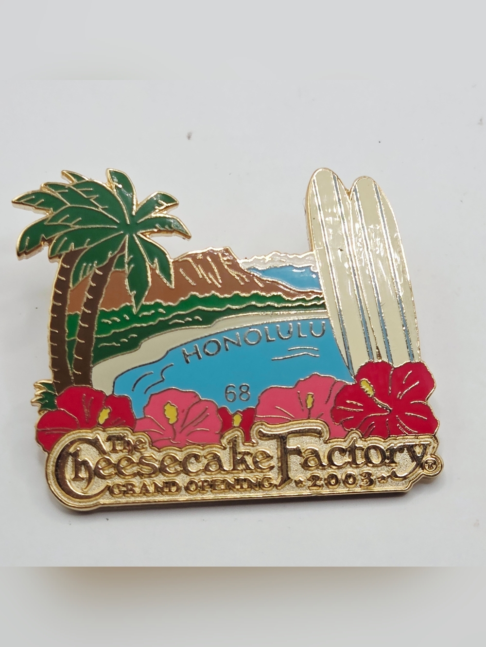 CHEESECAKE FACTORY PIN GRAND OPENING HONOLULU SURF BOARD PALM TREE LOGO 2003